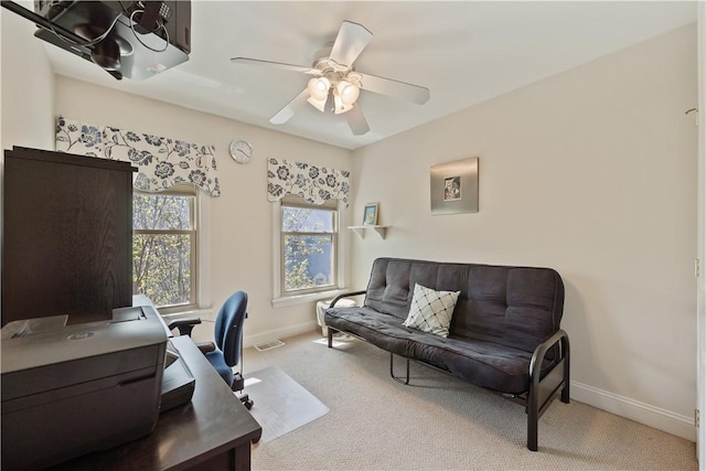office with baseboards, carpet flooring, and a ceiling fan