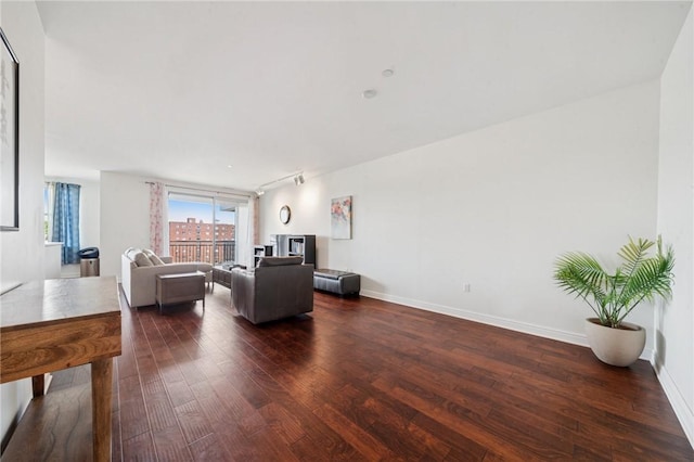 5570 Centre Ave Unit 403, Shadyside, PA 15232 - living room featuring dark wood-style flooring, baseboards, and rail lighting