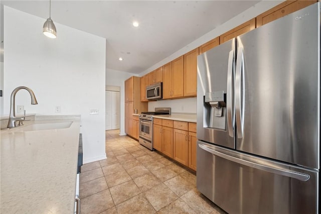 5570 Centre Ave Unit 403, Shadyside, PA 15232 - kitchen featuring stainless steel appliances, a sink, light countertops, recessed lighting, and pendant lighting