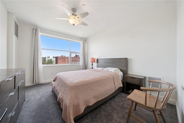 5570 Centre Ave Unit 403, Shadyside, PA 15232 - bedroom with baseboards, dark carpet, and a ceiling fan