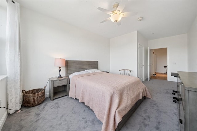 5570 Centre Ave Unit 403, Shadyside, PA 15232 - bedroom with light carpet, baseboards, and a ceiling fan