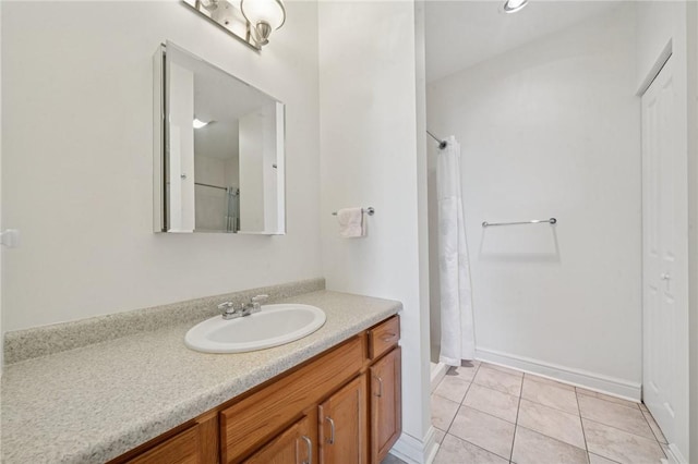 5570 Centre Ave Unit 403, Shadyside, PA 15232 - full bathroom featuring a stall shower, vanity, tile patterned floors, and baseboards