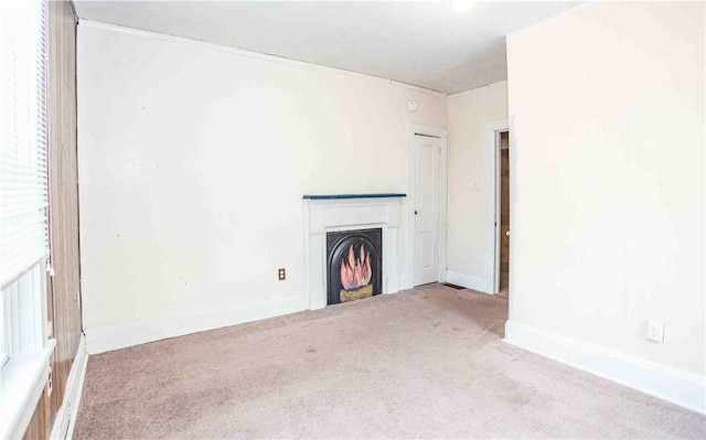 969 Water St, Indiana Boro, PA 15701 - unfurnished living room featuring carpet flooring, a lit fireplace, and baseboards