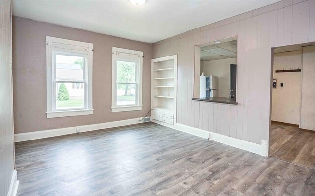 969 Water St, Indiana Boro, PA 15701 - unfurnished room with built in features, wood finished floors, baseboards, and wood walls