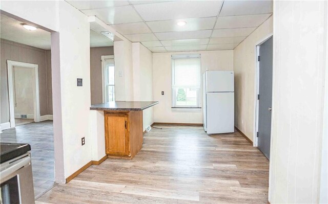 969 Water St, Indiana Boro, PA 15701 - kitchen featuring freestanding refrigerator, light wood-style flooring, baseboards, a drop ceiling, and stainless steel range with electric stovetop