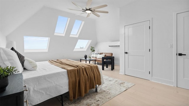 130 Prospect St, Mt Washington, PA 15211 - bedroom featuring a skylight, an AC wall unit, lofted ceiling, light wood finished floors, and a ceiling fan
