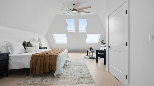 130 Prospect St, Mt Washington, PA 15211 - bedroom featuring a skylight, vaulted ceiling, light wood-style flooring, and a ceiling fan