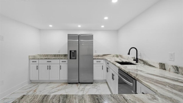 130 Prospect St, Mt Washington, PA 15211 - kitchen with stainless steel appliances, a sink, recessed lighting, light stone countertops, and light marble finish floors