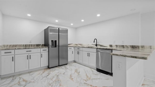 130 Prospect St, Mt Washington, PA 15211 - kitchen with appliances with stainless steel finishes, a sink, light marble finish flooring, a peninsula, and recessed lighting
