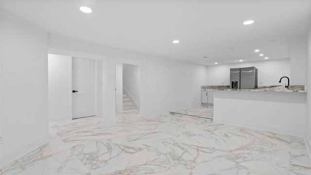 130 Prospect St, Mt Washington, PA 15211 - unfurnished living room with recessed lighting, stairway, baseboards, light marble finish floors, and a sink