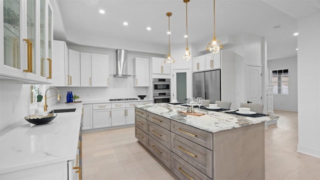 130 Prospect St, Mt Washington, PA 15211 - kitchen featuring wall chimney range hood, a sink, appliances with stainless steel finishes, light stone countertops, and recessed lighting