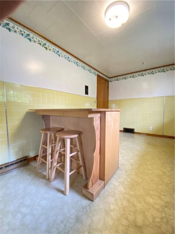 35 Kenmore Rd, West Salem Twp, PA 16125 - bar with light floors, baseboard heating, and tile walls