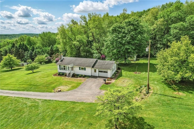35 Kenmore Rd, West Salem Twp, PA 16125 - view of front of property with asphalt driveway, a garage, a front yard, and a forest view