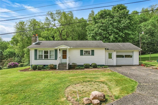 35 Kenmore Rd, West Salem Twp, PA 16125 - single story home with a chimney, asphalt driveway, an attached garage, and a front lawn
