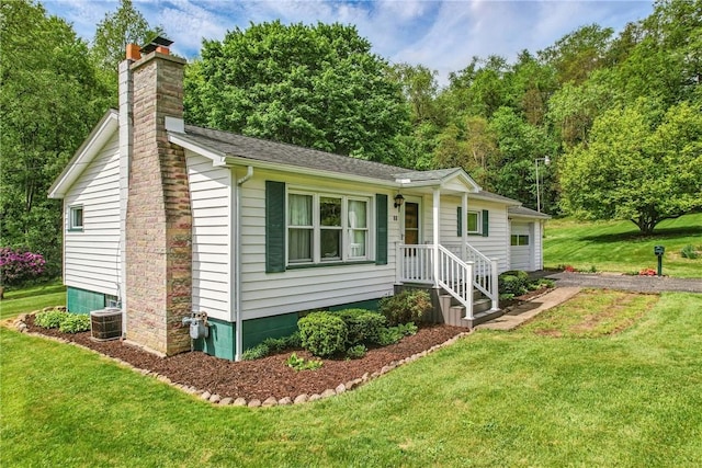35 Kenmore Rd, West Salem Twp, PA 16125 - view of front of home featuring a chimney, a front yard, a garage, and central AC