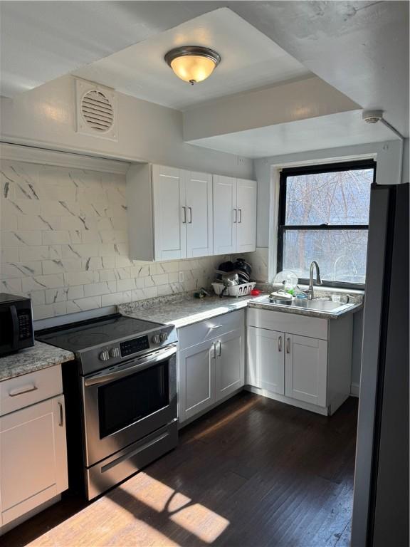 1215 Schimmer St, Brighton Heights, PA 15212 - kitchen featuring appliances with stainless steel finishes, a sink, tasteful backsplash, and light countertops