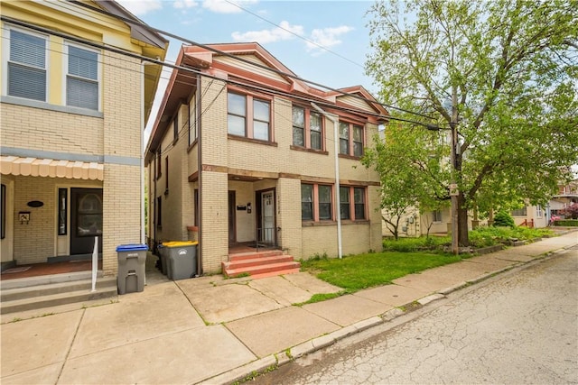 multi unit property featuring brick siding