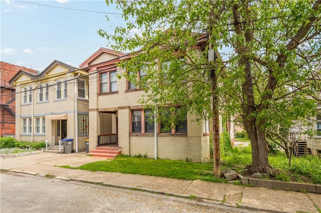 view of front of property featuring brick siding