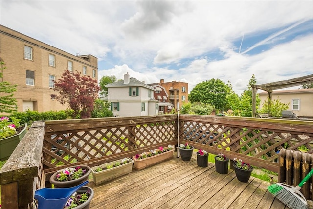 wooden deck with a residential view