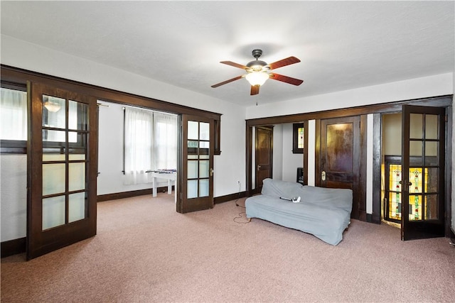 bedroom featuring french doors, carpet flooring, and baseboards