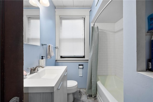full bath with toilet, vanity, and shower / bath combination with curtain
