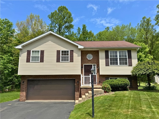 202 Jefferson Ct, Slippery Rock Boro, PA 16057 - split foyer home with a garage, driveway, a front lawn, and brick siding
