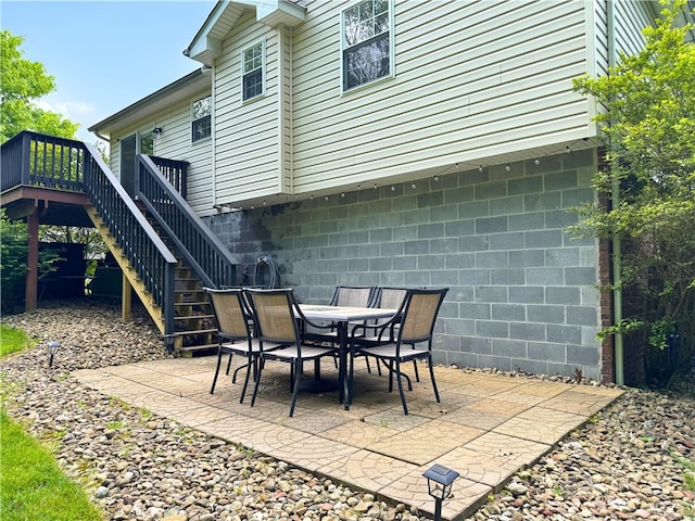 202 Jefferson Ct, Slippery Rock Boro, PA 16057 - view of patio with stairway, a wooden deck, and outdoor dining area
