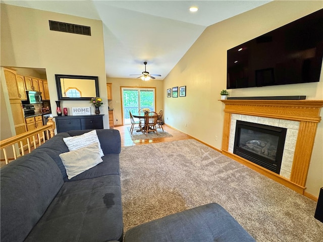 202 Jefferson Ct, Slippery Rock Boro, PA 16057 - carpeted living room with ceiling fan, a fireplace, baseboards, and high vaulted ceiling