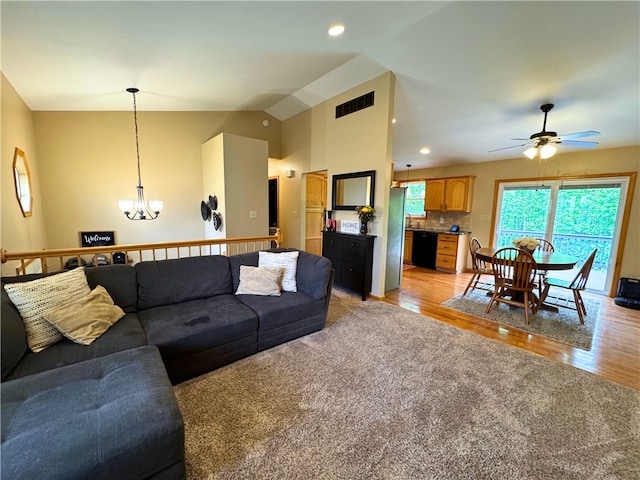 202 Jefferson Ct, Slippery Rock Boro, PA 16057 - living area featuring a chandelier, ceiling fan, lofted ceiling, light colored carpet, and light wood finished floors