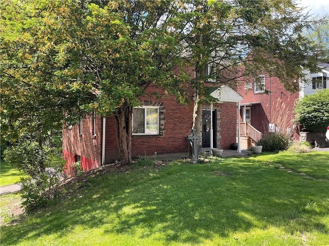 110 Orin St, Penn Hills, PA 15235 - view of front of property featuring a front lawn and brick siding