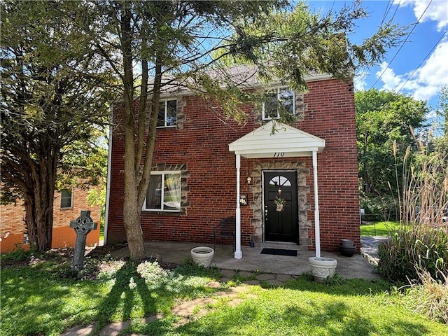 110 Orin St, Penn Hills, PA 15235 - property entrance with brick siding and a lawn