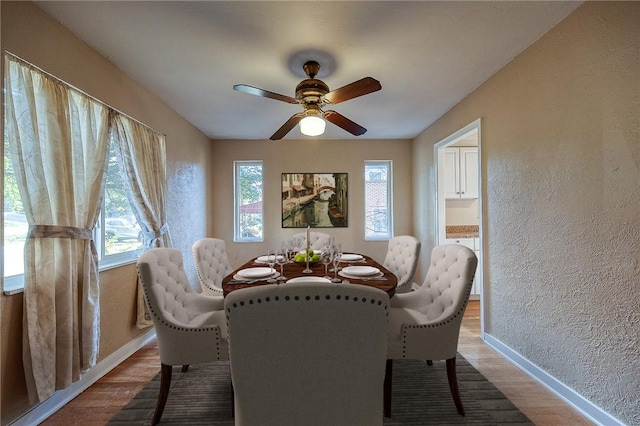 110 Orin St, Penn Hills, PA 15235 - dining area featuring wood finished floors, baseboards, a textured wall, and a ceiling fan