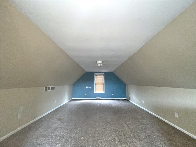 bonus room with baseboards, carpet, and vaulted ceiling