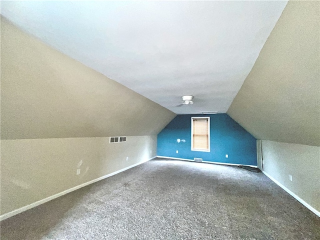 bonus room with carpet, vaulted ceiling, and baseboards