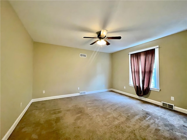 spare room with a ceiling fan, baseboards, and carpet flooring