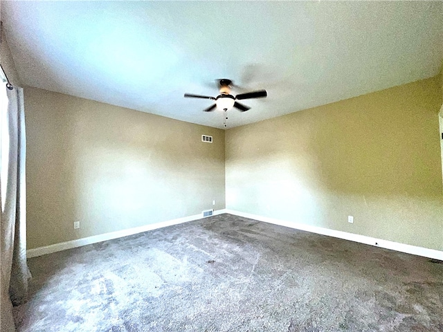 empty room featuring carpet, ceiling fan, and baseboards