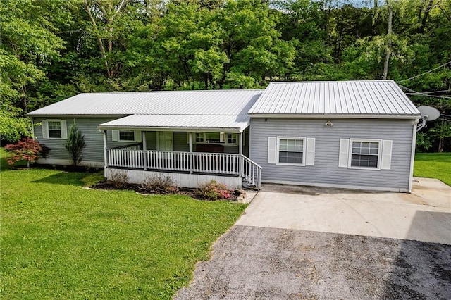 431 Mount Morris Rd, Kirby/Mtmorris, PA 15349 - ranch-style home with covered porch, a front yard, and metal roof