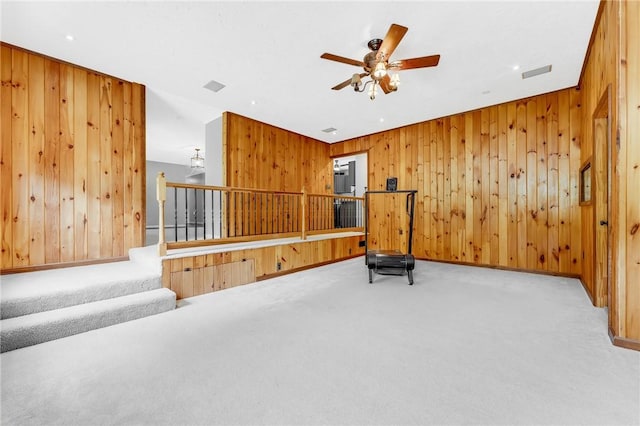 431 Mount Morris Rd, Kirby/Mtmorris, PA 15349 - workout area with carpet flooring, wooden walls, a ceiling fan, and baseboards