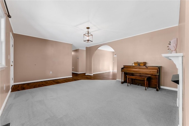 431 Mount Morris Rd, Kirby/Mtmorris, PA 15349 - carpeted empty room with arched walkways, baseboards, and ornamental molding