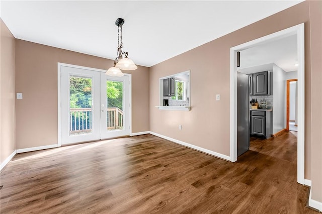 431 Mount Morris Rd, Kirby/Mtmorris, PA 15349 - unfurnished dining area with baseboards, dark wood finished floors, and french doors