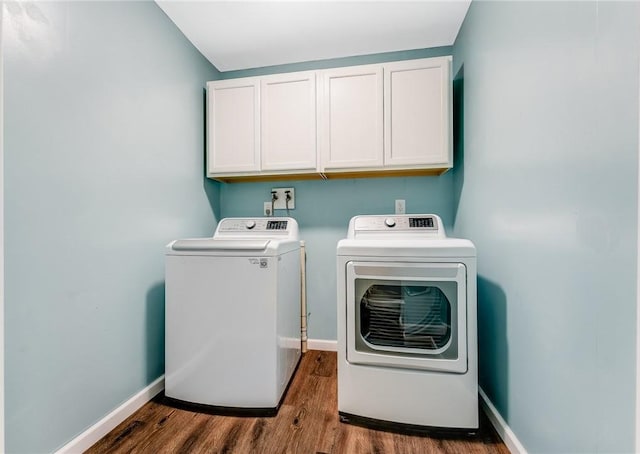 431 Mount Morris Rd, Kirby/Mtmorris, PA 15349 - clothes washing area with cabinet space, washing machine and dryer, wood finished floors, and baseboards