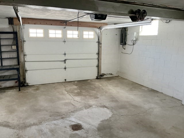 13 Schoen St, Mckees Rocks, PA 15136 - garage with a garage door opener and electric panel