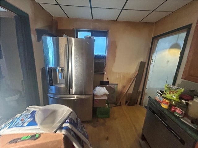 831 Forest Ave, West Homestead, PA 15120 - kitchen featuring stainless steel refrigerator with ice dispenser, a drop ceiling, and wood finished floors