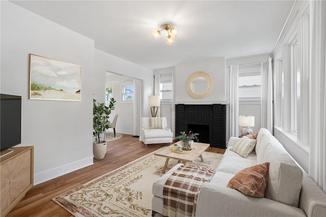 123 Bascom Ave, Observatory Hill, PA 15214 - living area with wood finished floors, baseboards, and a fireplace