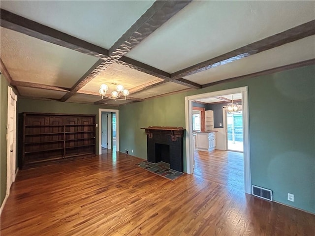 508 Woodside Rd, Forest Hills Boro, PA 15221 - unfurnished living room with a chandelier, wood finished floors, coffered ceiling, beamed ceiling, and baseboards