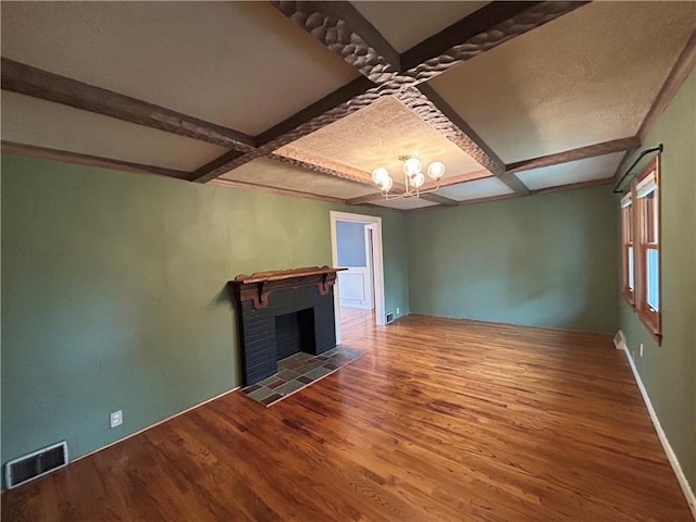 508 Woodside Rd, Forest Hills Boro, PA 15221 - unfurnished living room with coffered ceiling, wood finished floors, beam ceiling, a fireplace, and baseboards