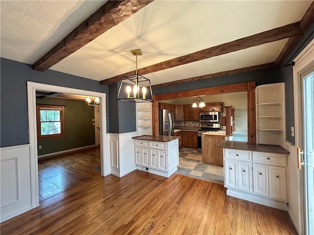 508 Woodside Rd, Forest Hills Boro, PA 15221 - kitchen with stainless steel appliances, a chandelier, dark countertops, a peninsula, and open shelves