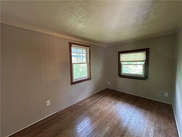 508 Woodside Rd, Forest Hills Boro, PA 15221 - unfurnished room featuring wood-type flooring, crown molding, and a textured ceiling