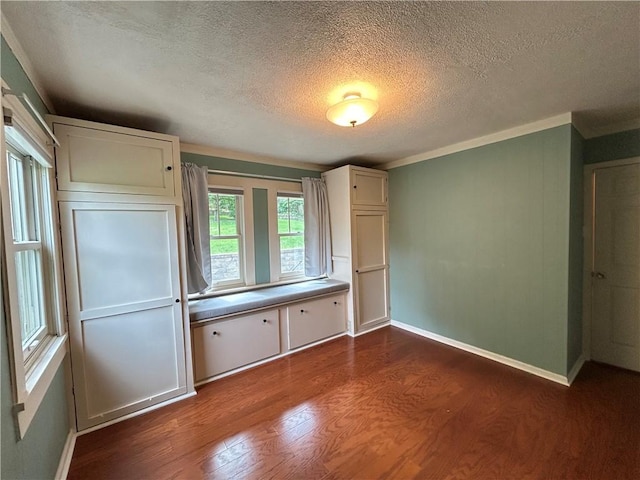 508 Woodside Rd, Forest Hills Boro, PA 15221 - unfurnished bedroom with dark wood-style flooring, a textured ceiling, baseboards, and crown molding