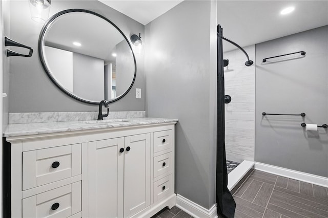 3289 Dawson St Unit 1, Oakland, PA 15213 - bathroom with baseboards, tiled shower, vanity, and recessed lighting